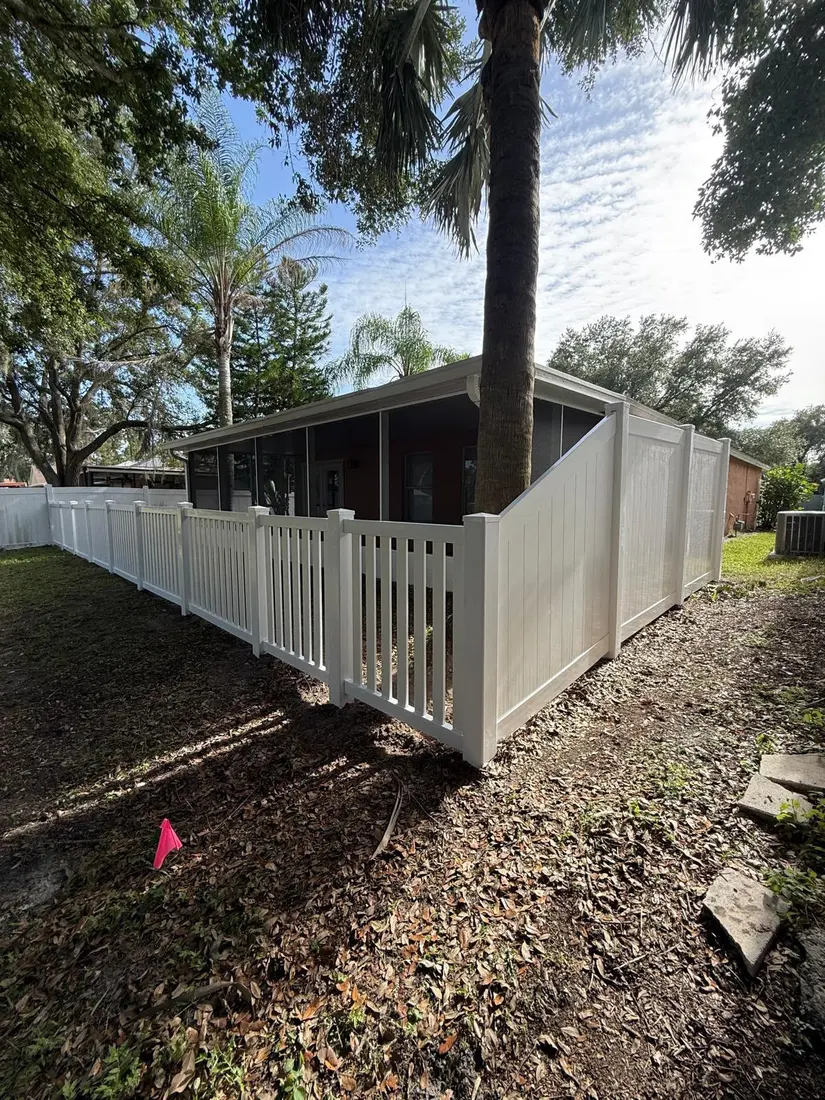 White vinyl fence post and gate hardware detail